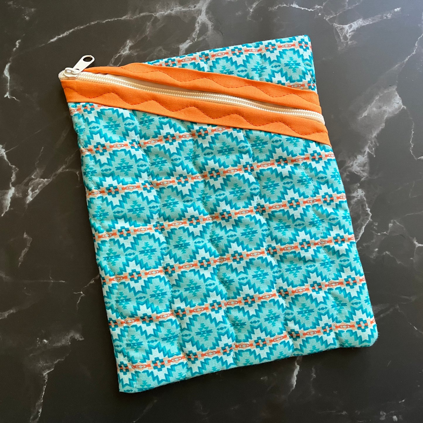 Aztec design book sleeve is perfect for carrying books or electronics.
