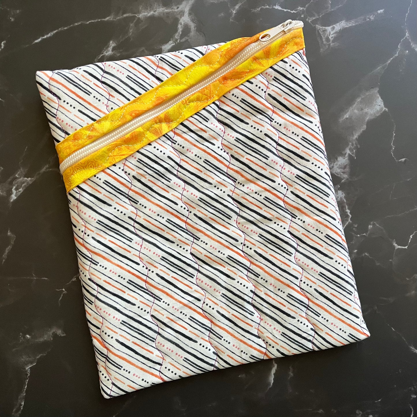 Book sleeves are perfect for protecting your books and electronics while traveling.
