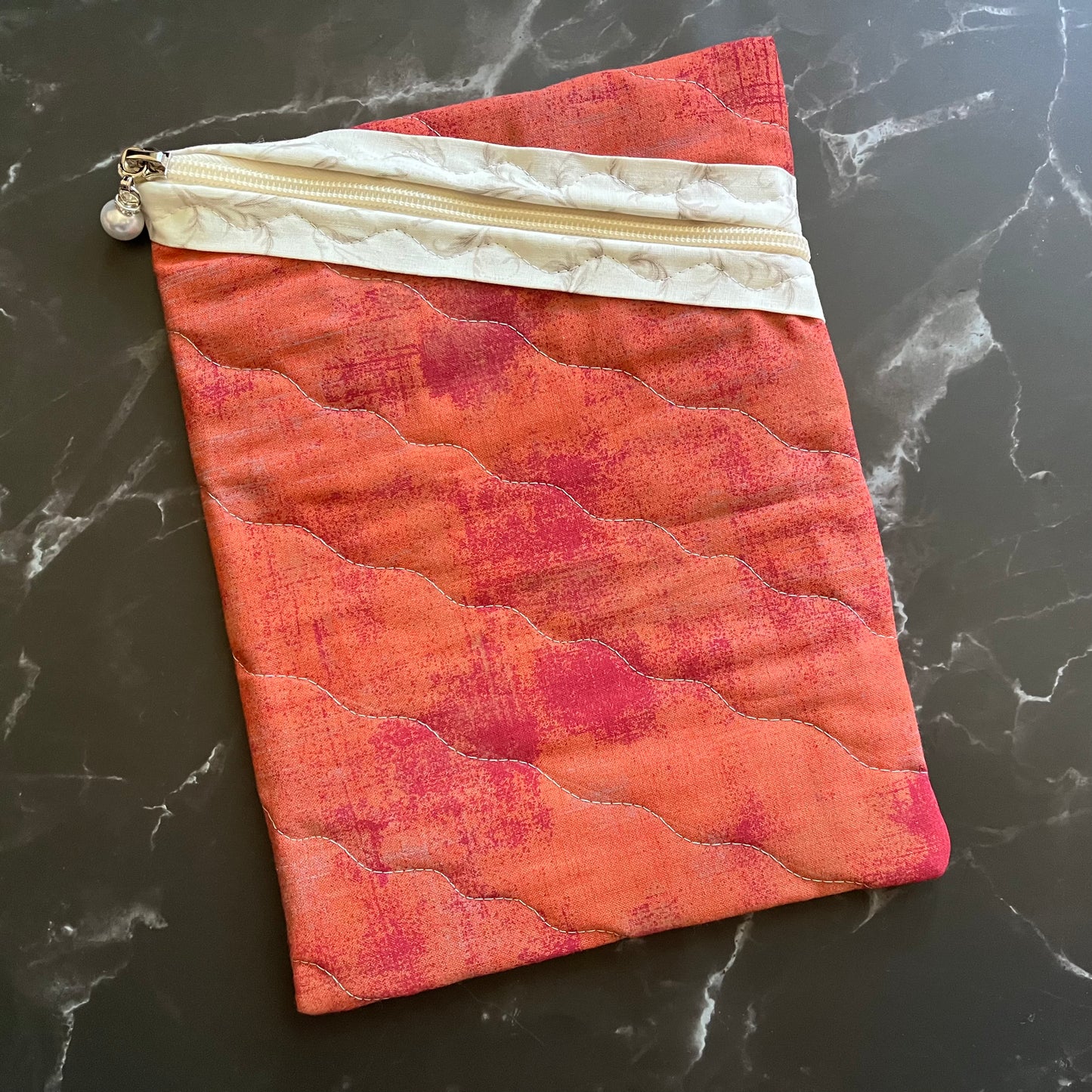 Large book sleeve to carry books or electronics.